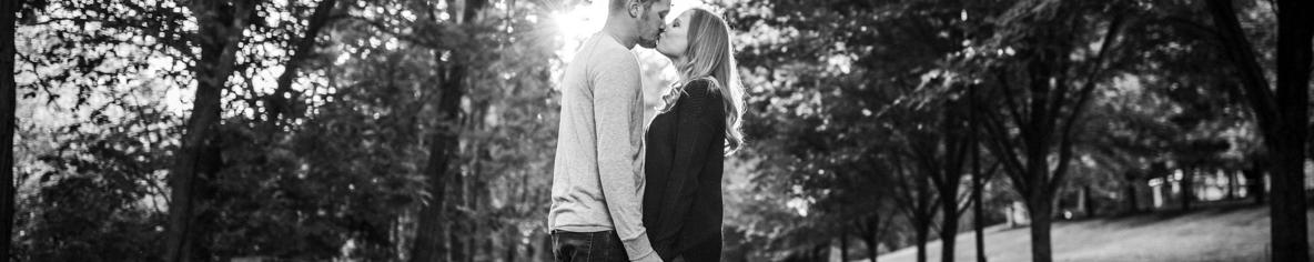 Save the date photo of couple kissing in black and white