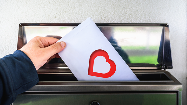 person mailing their save the date