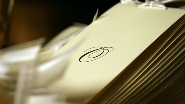 a pile of wedding programs