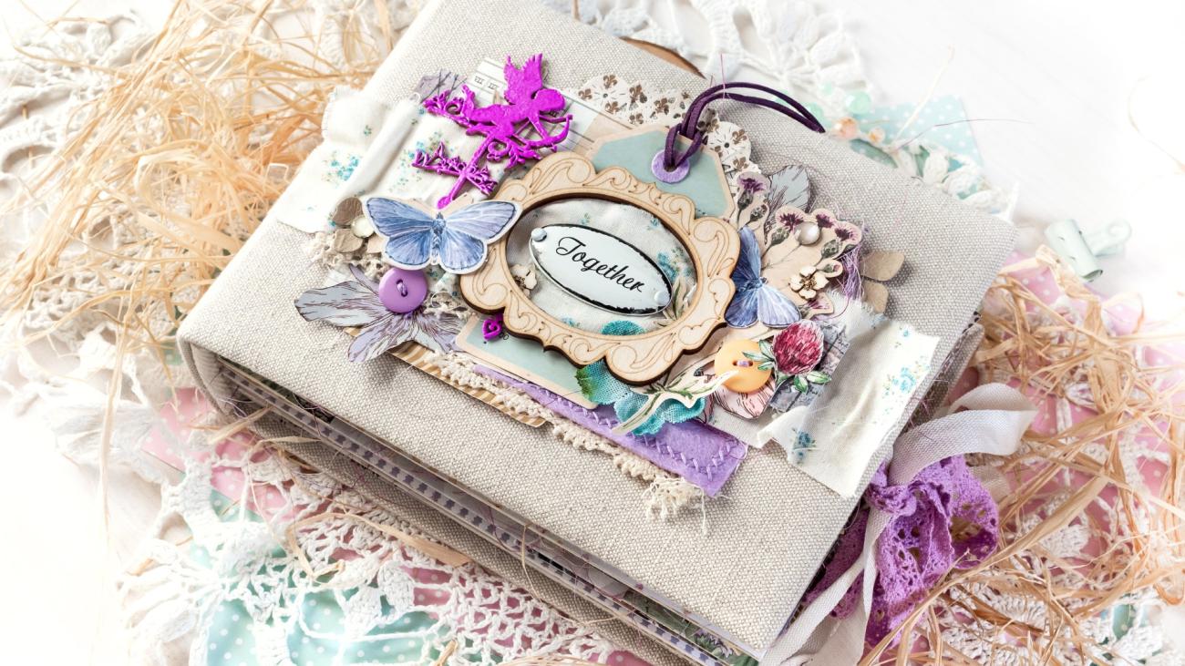 a wedding program album labeled with the word “together” on the front cover