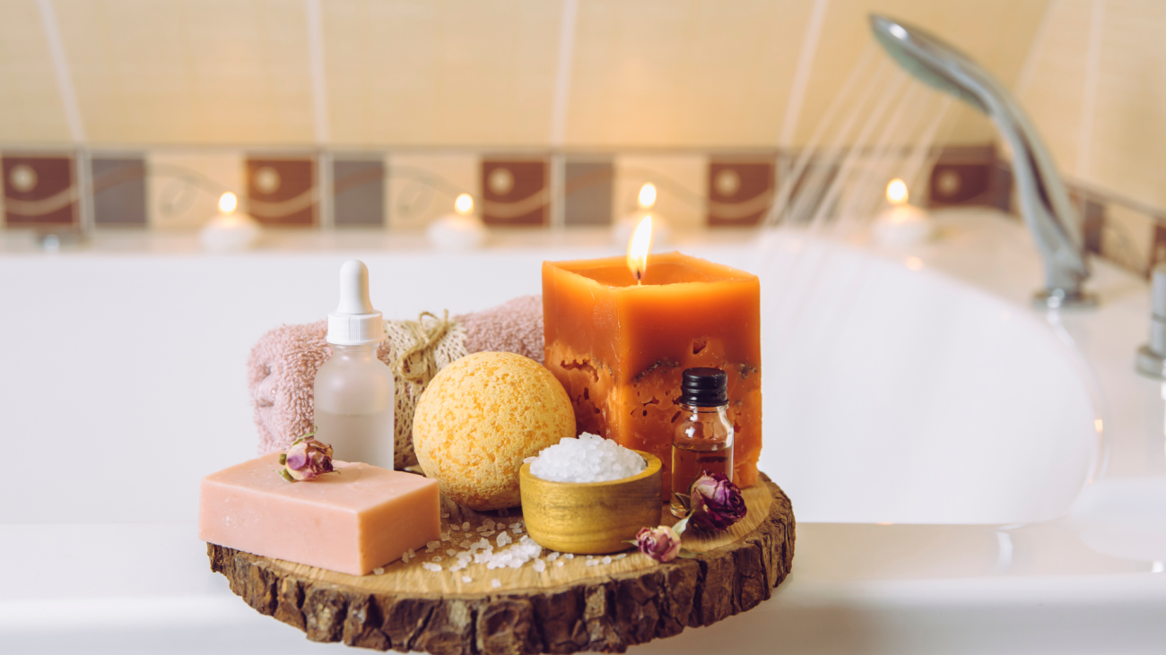 a bubble bath with a candle and bath salts