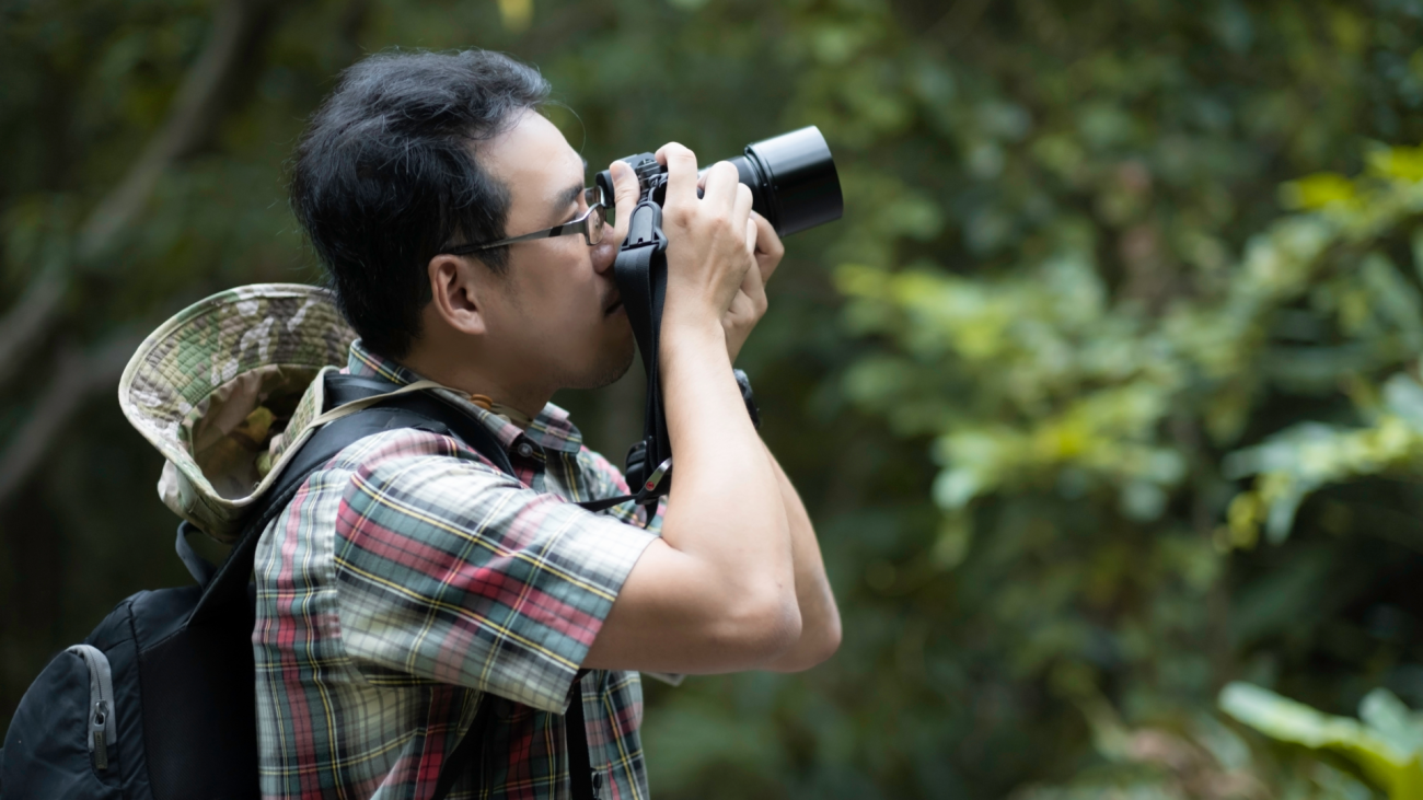 a photographer takes photo outdoors