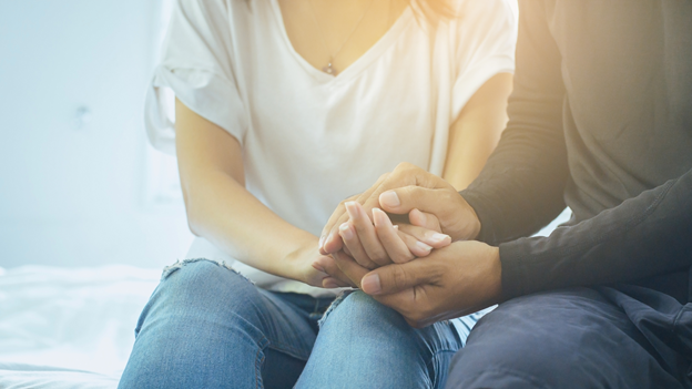 two people holding hands