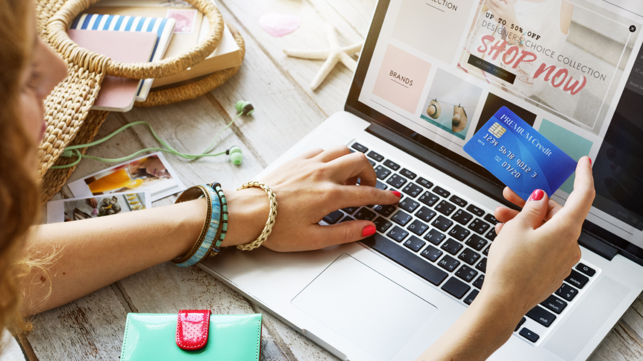 a woman shops online with her credit card