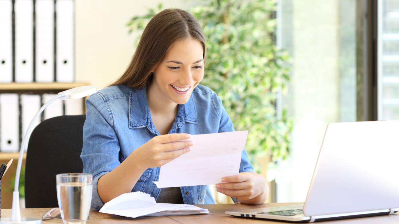 a woman opens a card