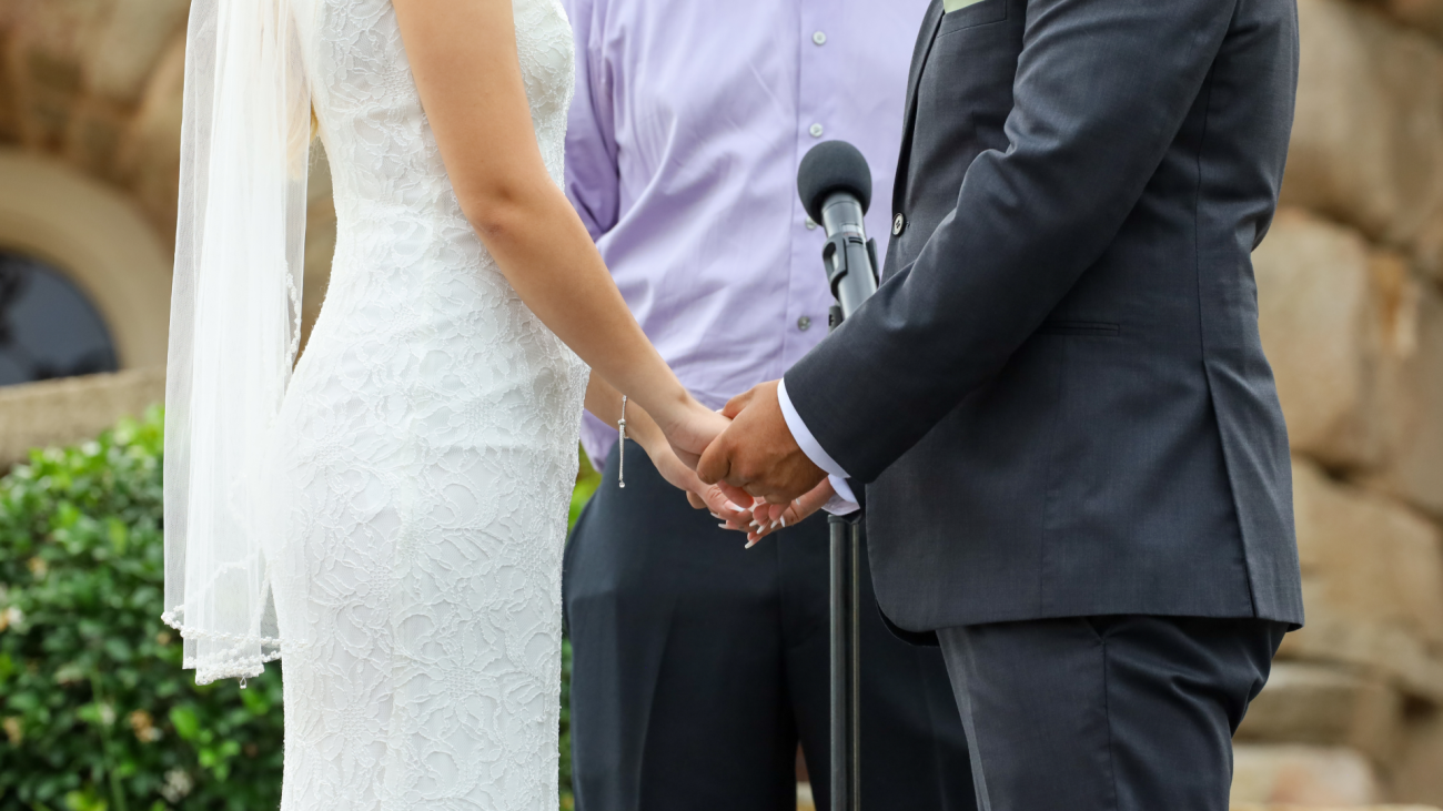 a couple exchanges wedding vows