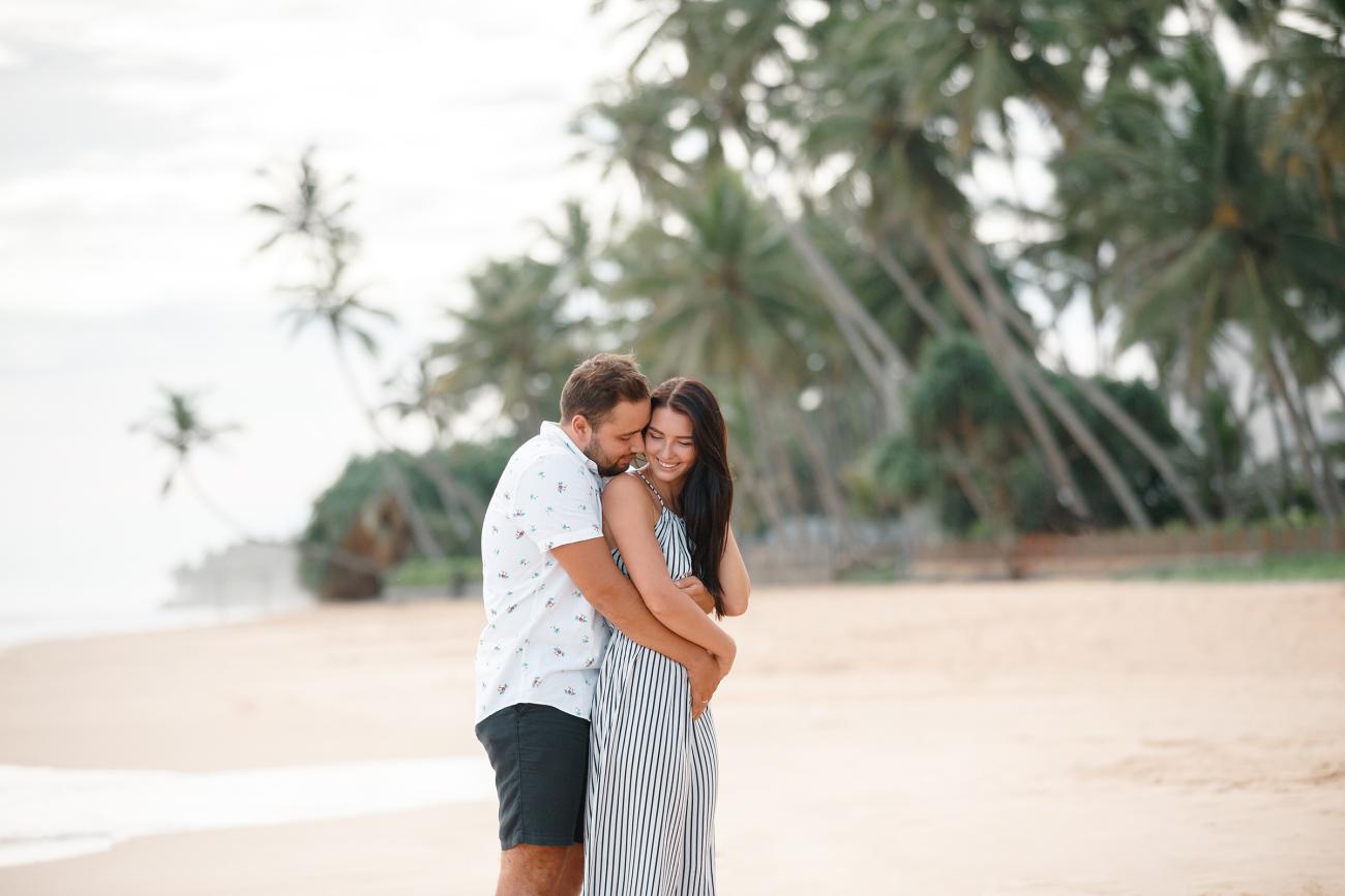 Happy couple embracing on the beach