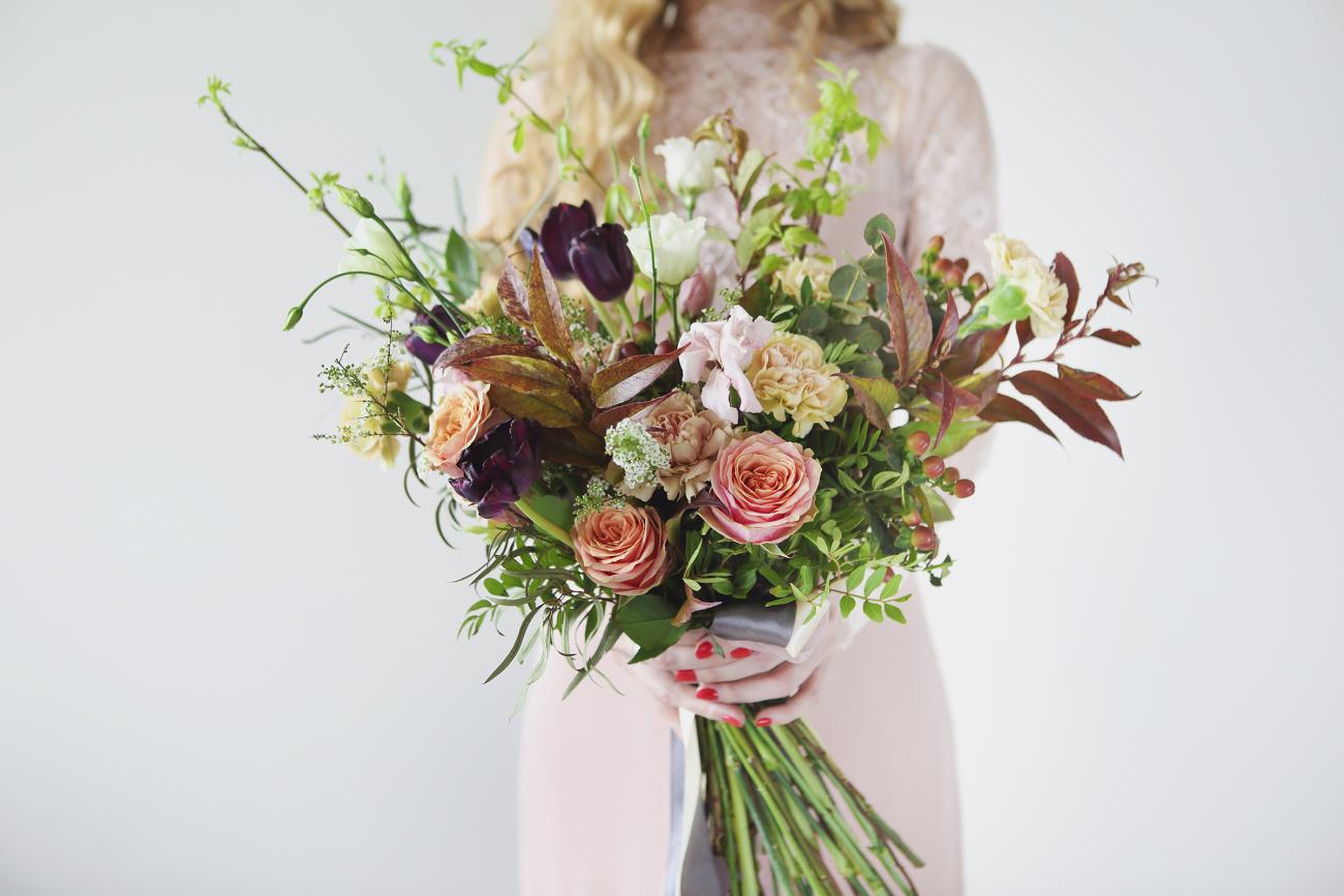 Woman holding a beautiful bouquet of flowers