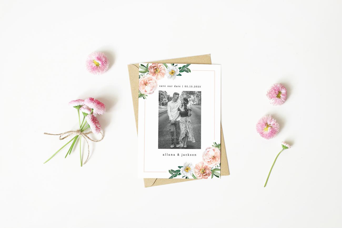 Floral save the date with flowers scattered around it