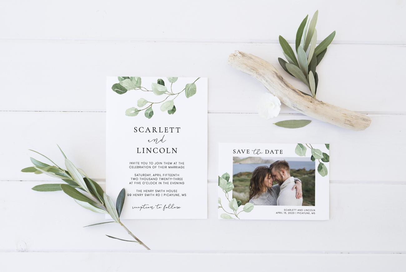 Matching wedding invitation and save the date card surrounded by sprigs