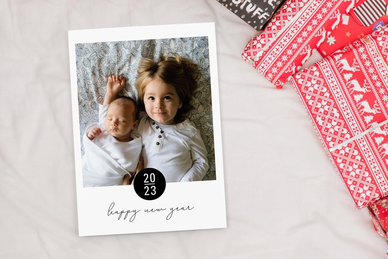 New Year's Cards next to Christmas presents