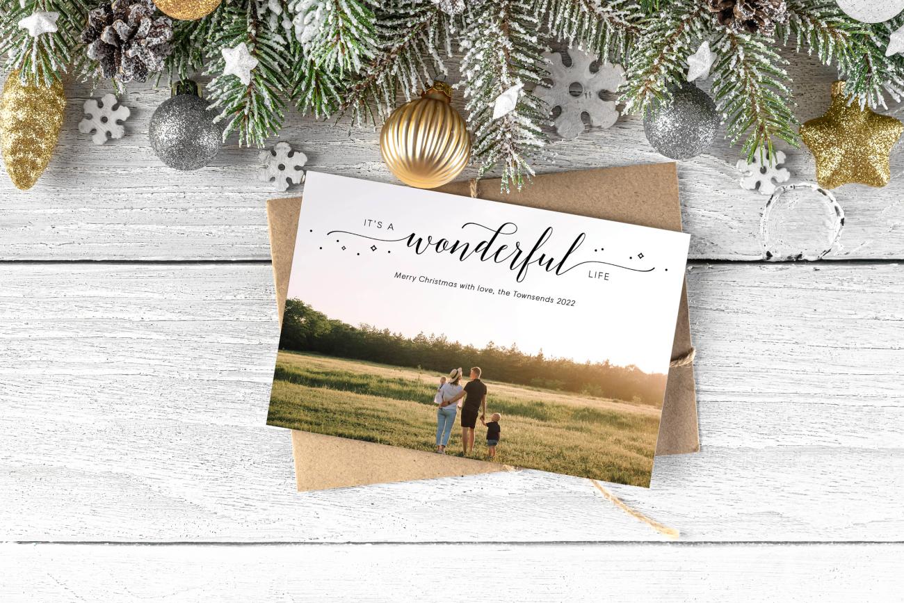 Classic Christmas Cards next to holiday greenery