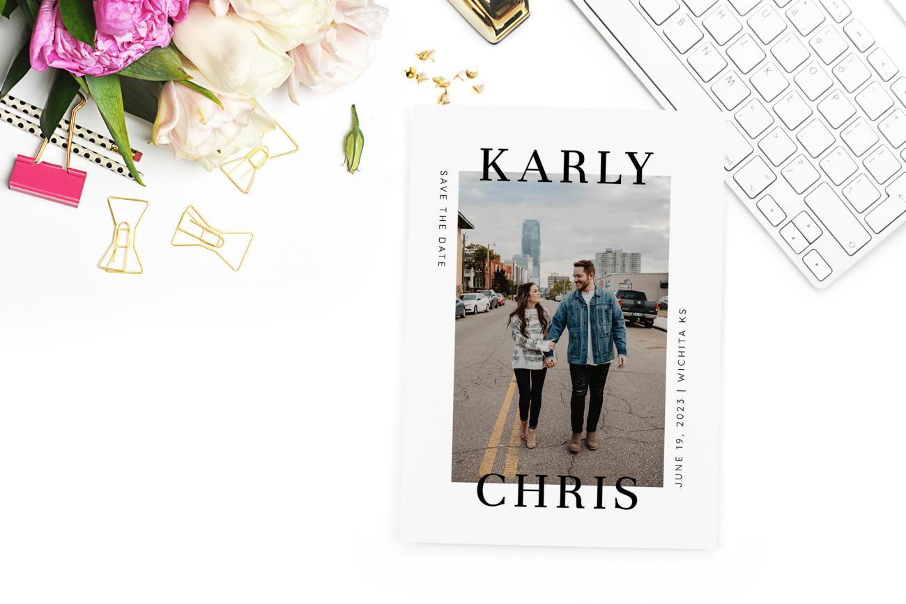 Photo Save the Date on a feminine desk with flowers