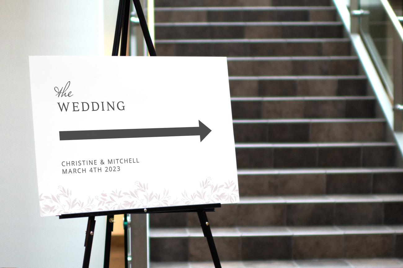 Wedding directional sign next to stairs