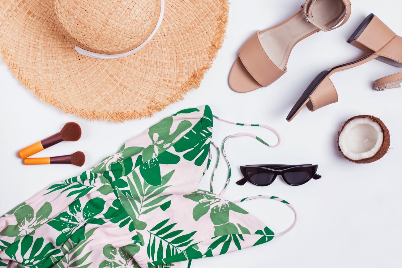 Beach formal Wedding Attire of sundress, sandals, sunhat and sunglasses