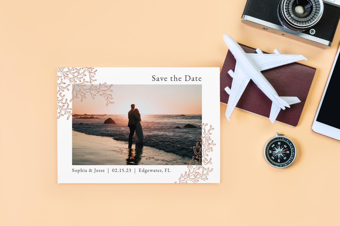 Destination Save the Date with airplane, camera, and compass