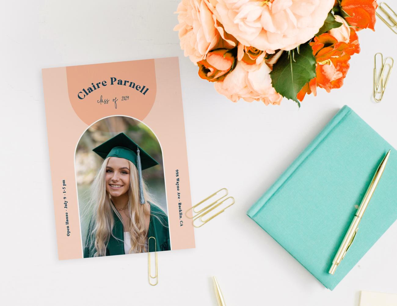 Graduation Announcement with pretty flowers on desk
