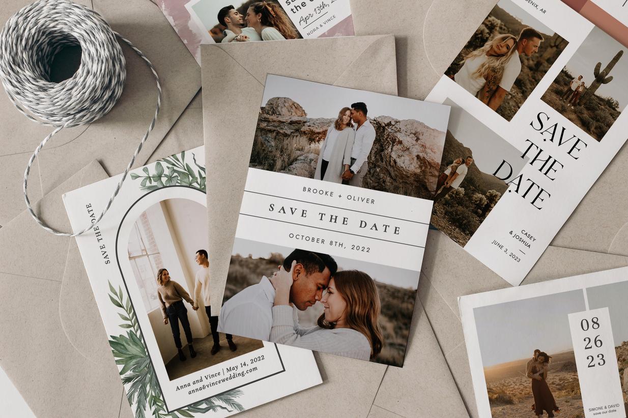 Big pile of save the date cards and envelopes