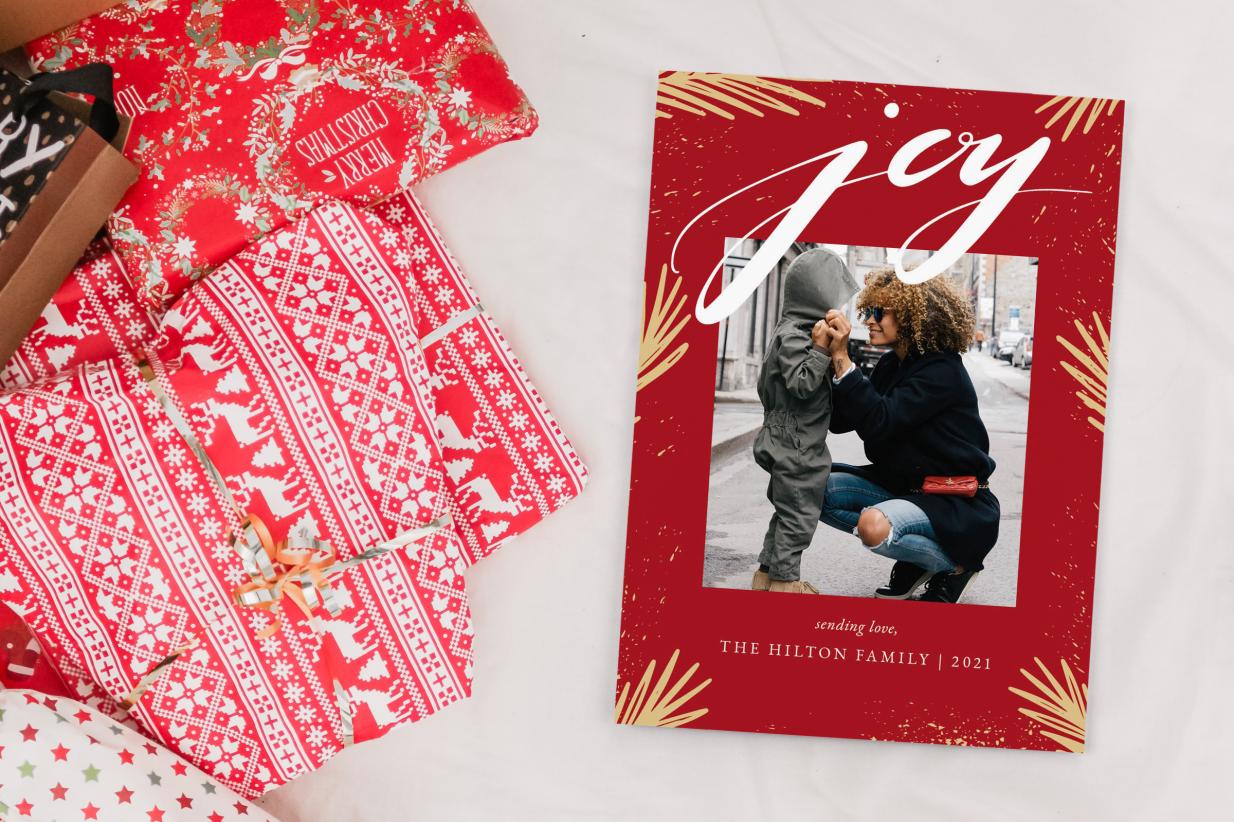 Christmas Card next to Christmas presents
