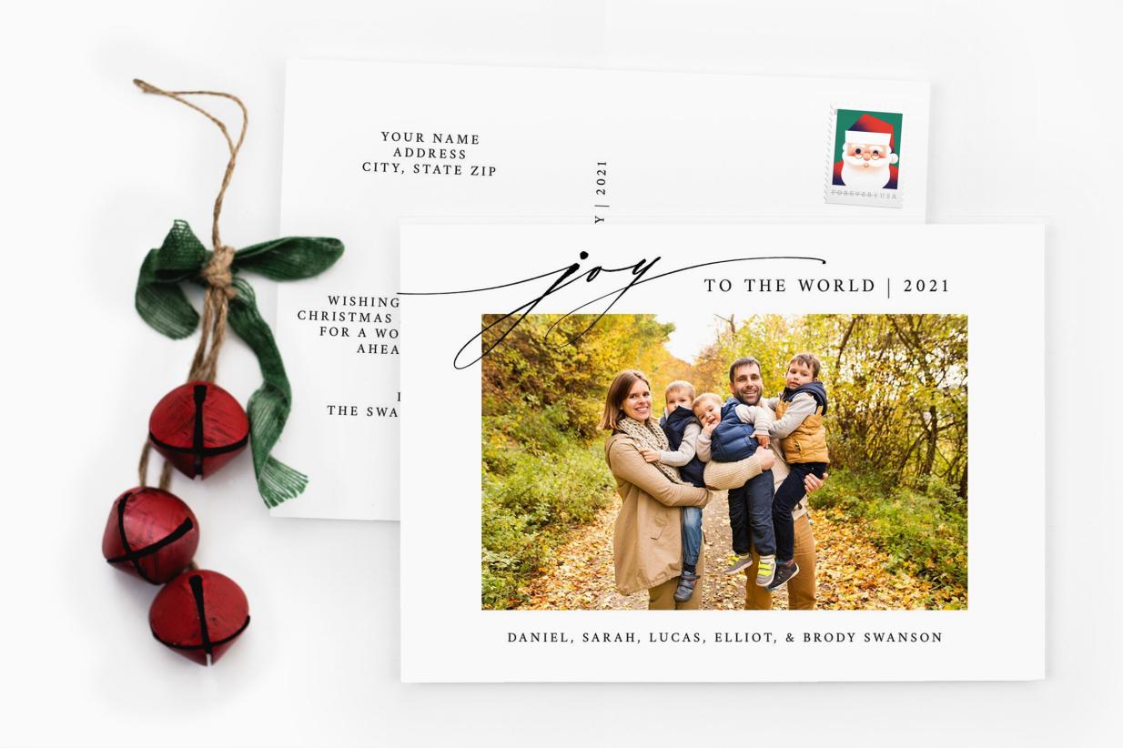 Christmas Postcard next to Red Christmas Bells