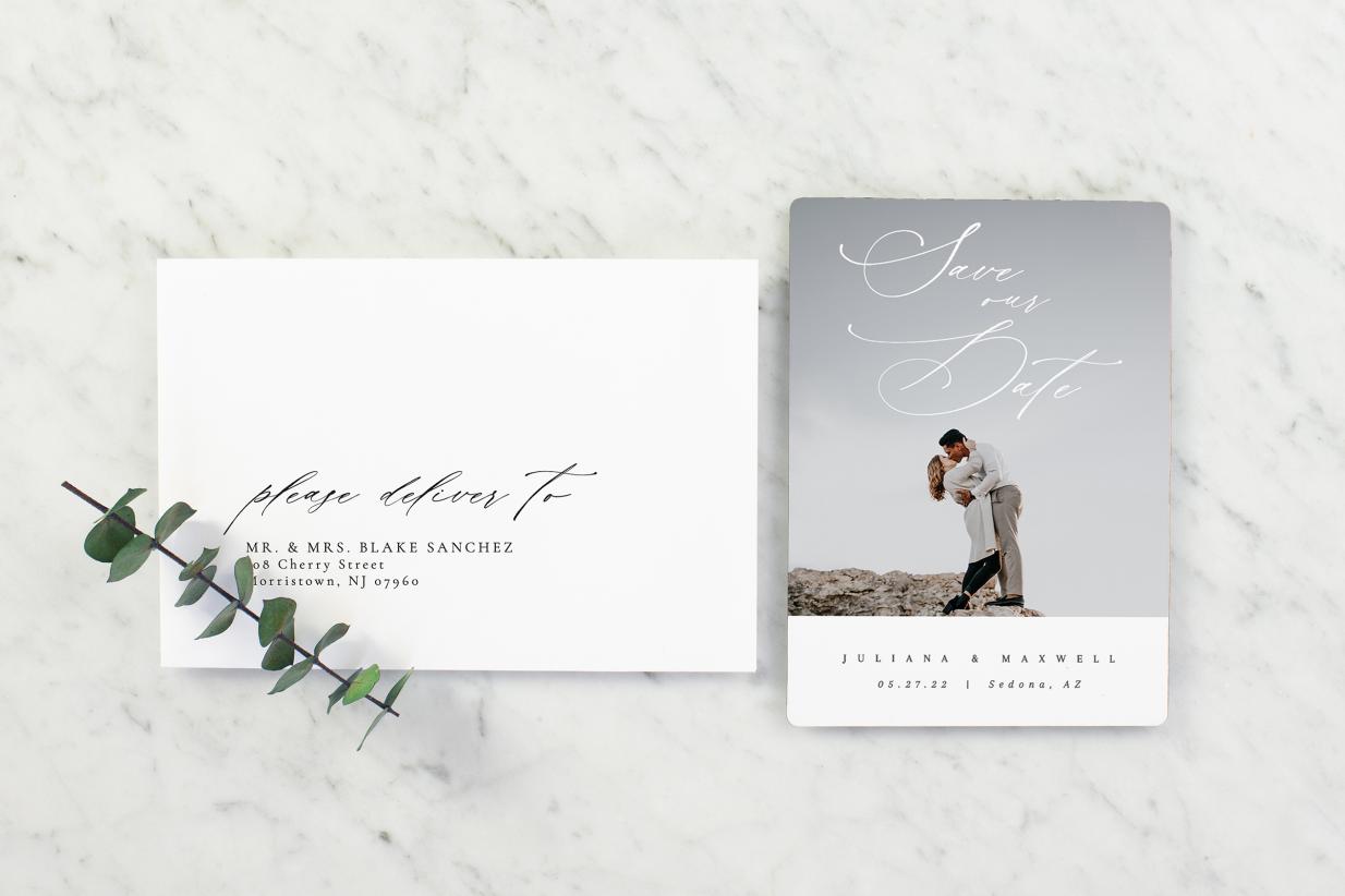 Save the date magnet next to envelope with guest addressing