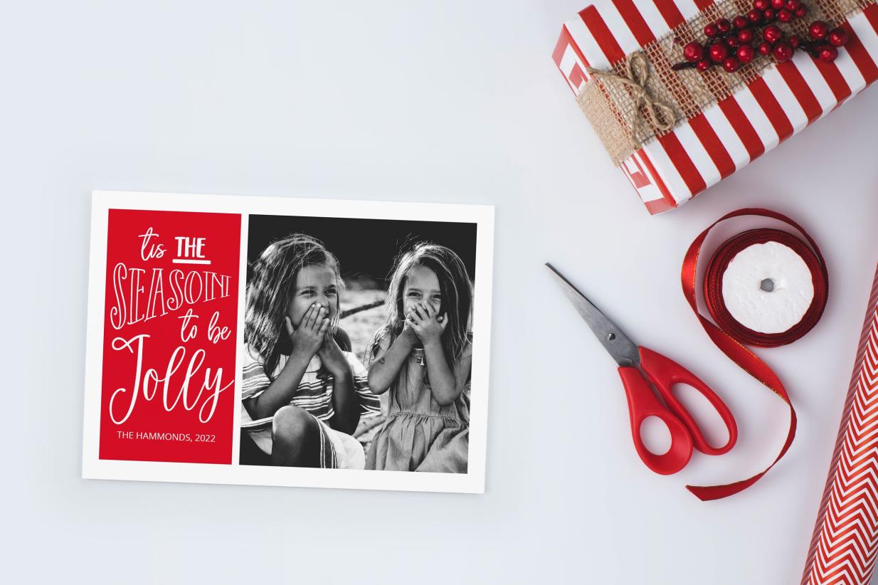 Unique Christmas Cards next to wrapping paper