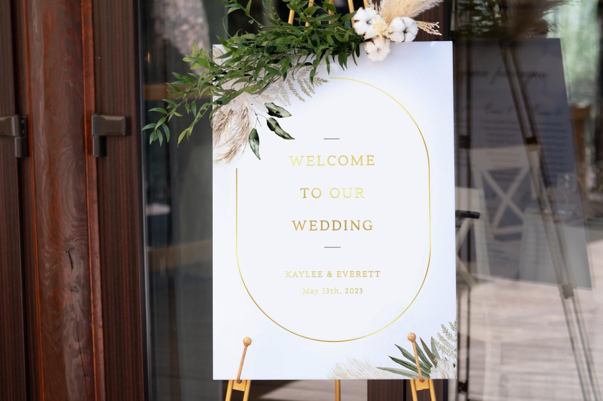 Gold Foil Wedding Welcome Sign in front of a door