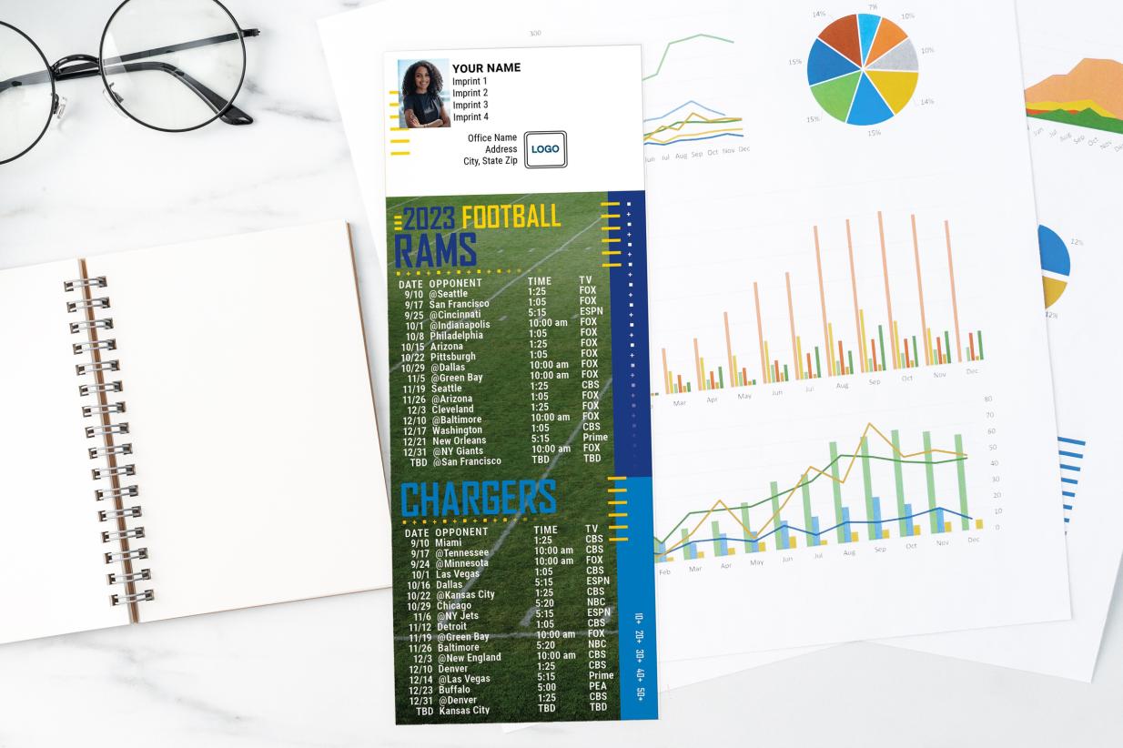 Football Schedules on a desk with charts, notebook, and glasses