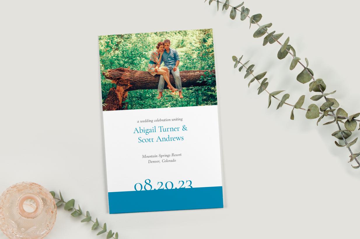 Personalized Wedding Program that is folded with greenery