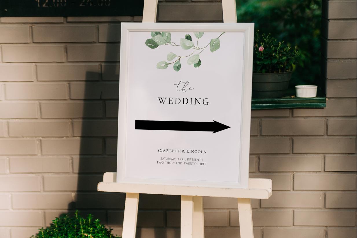 Wedding Sign in a Modern greenery design against a brick wall