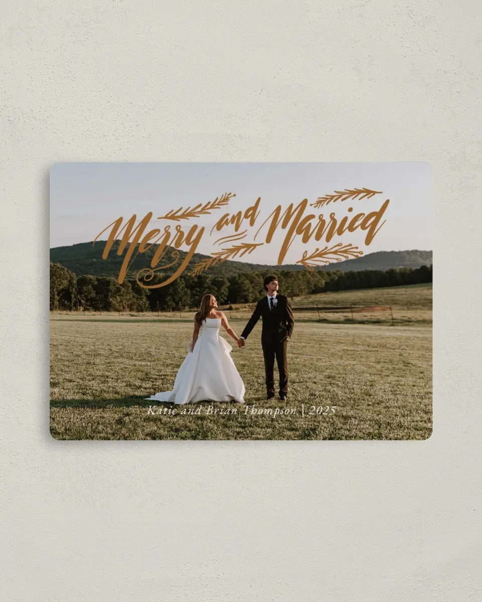 This is a 4" x 5½" Christmas Card called Merrily Married printed in full color with Gold foil and a Luxe Satin finish