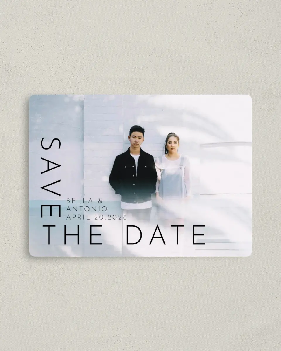 This is a 4" x 5½" Save the Date Magnet called Cornered By Love printed in full color with Rose Gold foil and a Luxe Satin finish