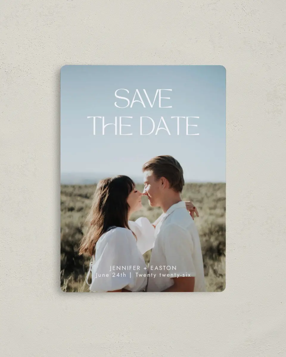This is a 4" x 5½" Save the Date Magnet called Soft Style printed in full color with Rose Gold foil and a Luxe Satin finish