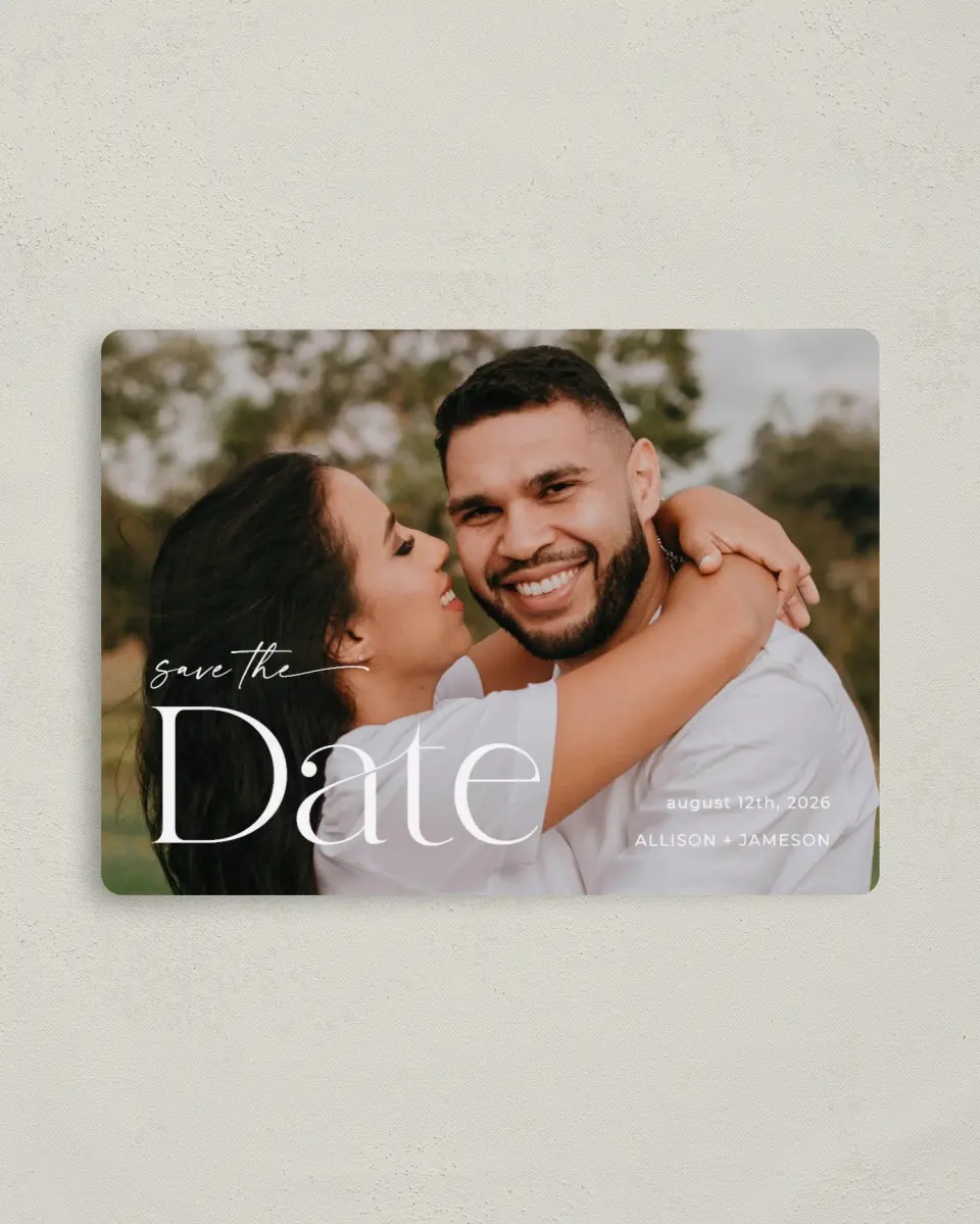 This is a 4" x 5½" Save the Date Magnet called Grand Date printed in full color with Rose Gold foil and a Luxe Satin finish