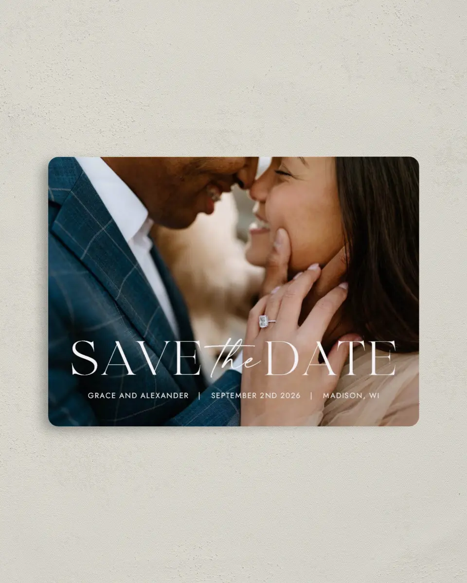 This is a 4" x 5½" Save the Date Magnet called Confident Couple printed in full color with Rose Gold foil and a Luxe Satin finish