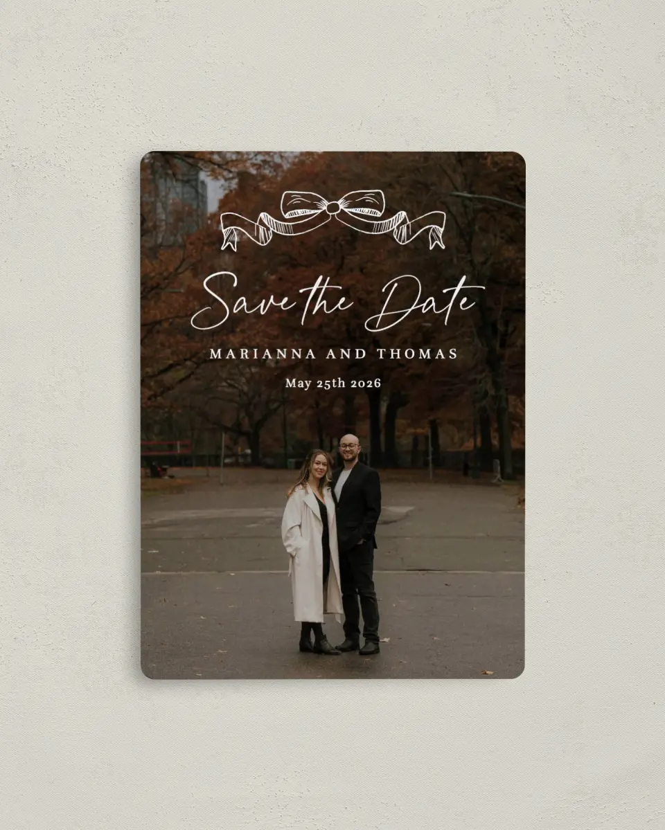 This is a 4" x 5½" Save the Date Magnet called Ribbon Romance printed in full color with Rose Gold foil and a Luxe Satin finish