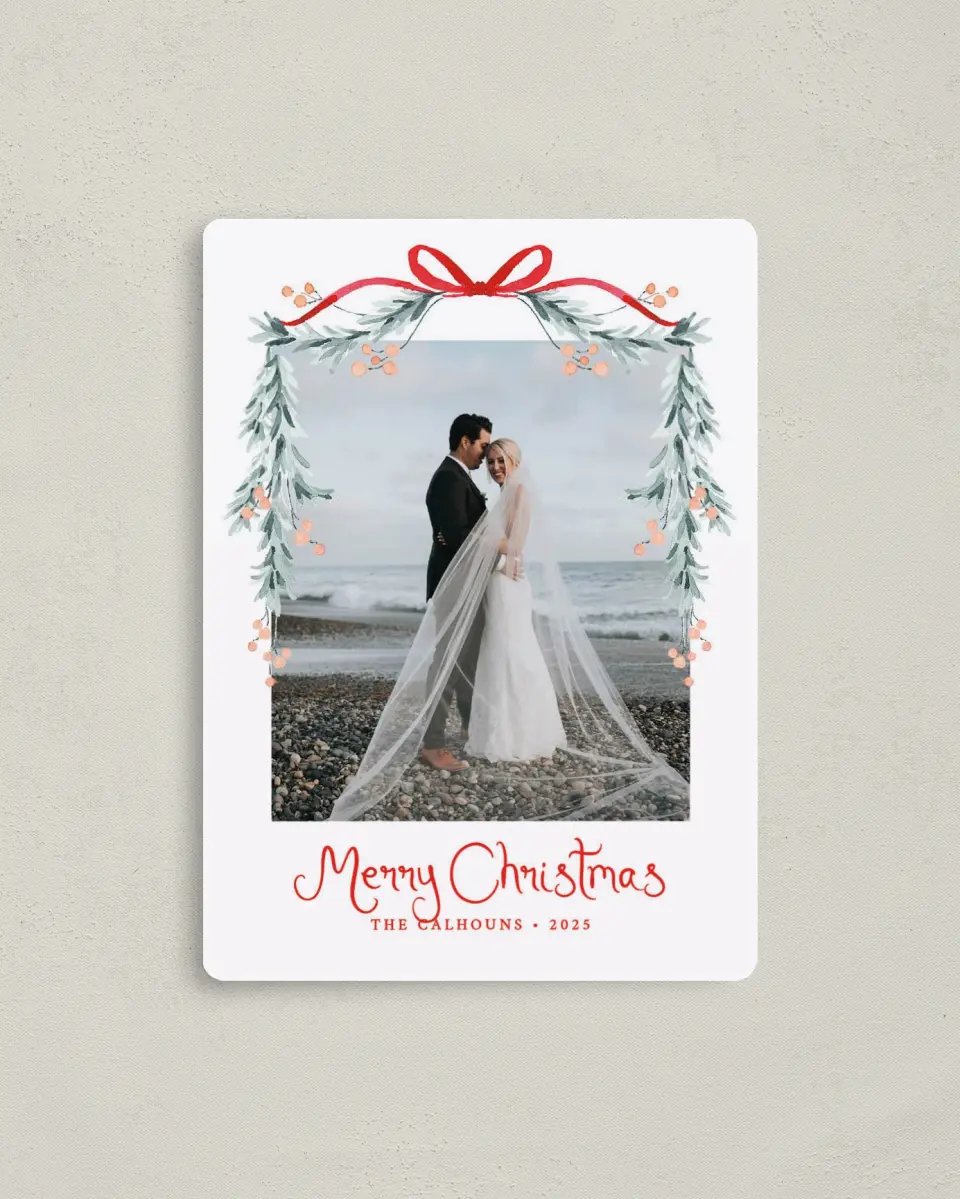 This is a 4" x 5½" Christmas Card called Blushing Bow printed in full color with Rose Gold foil and a Luxe Satin finish