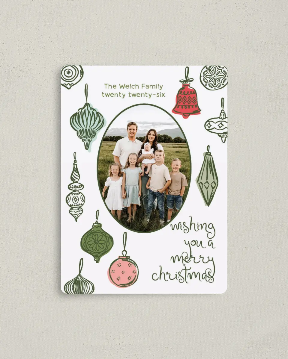 This is a 4" x 5½" Christmas Card called Baubled Boughs printed in full color with Silver foil and a Luxe Satin finish
