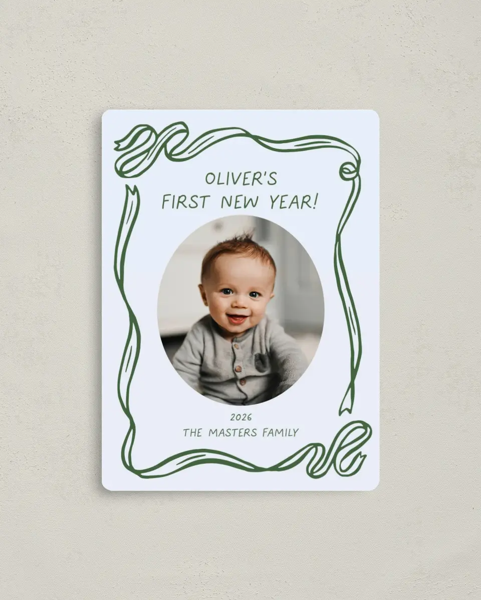 This is a 4" x 5½" Christmas Card called Wrapped in Firsts printed in full color with Gold foil and a Luxe Satin finish