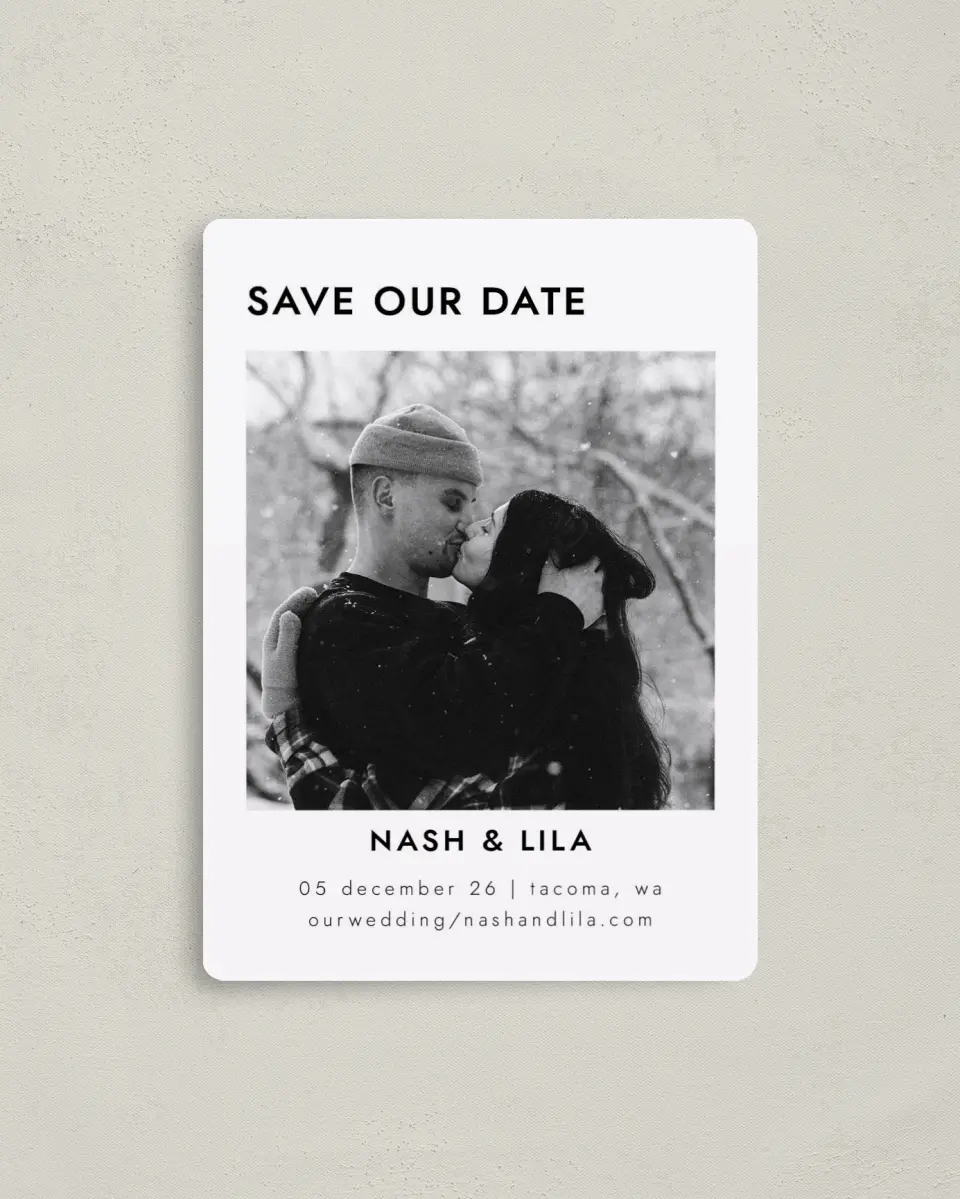 This is a 4" x 5½" Save the Date Magnet called Snowy Kisses printed in full color with Gold foil and a Luxe Satin finish