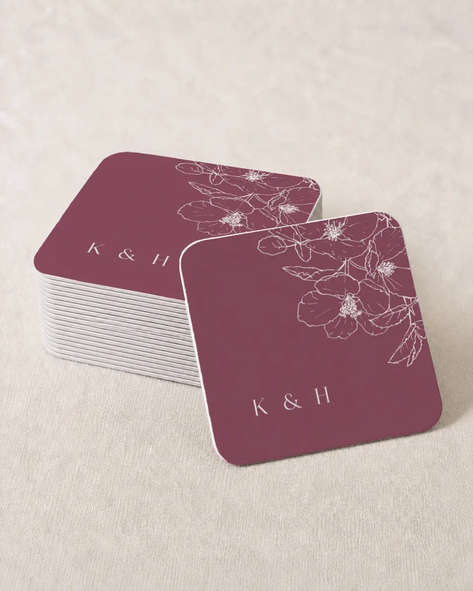 This is a 4" x 4" Wedding Coaster called The Kinsley printed in full color with Rose Gold foil on Kraft Chipboard paper