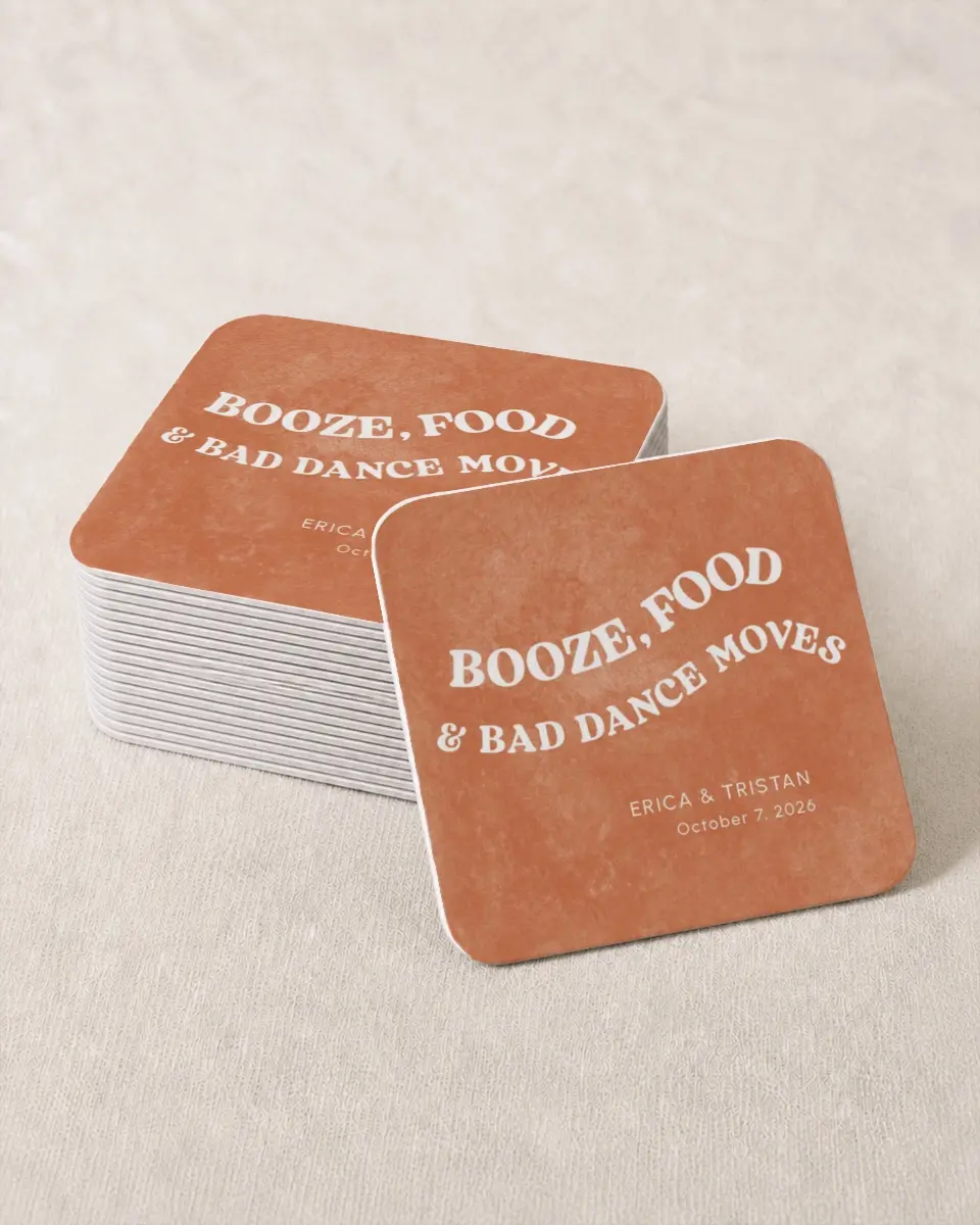 This is a 4" x 4" Wedding Coaster called Bad Dance Moves printed in full color with Rose Gold foil on Kraft Chipboard paper