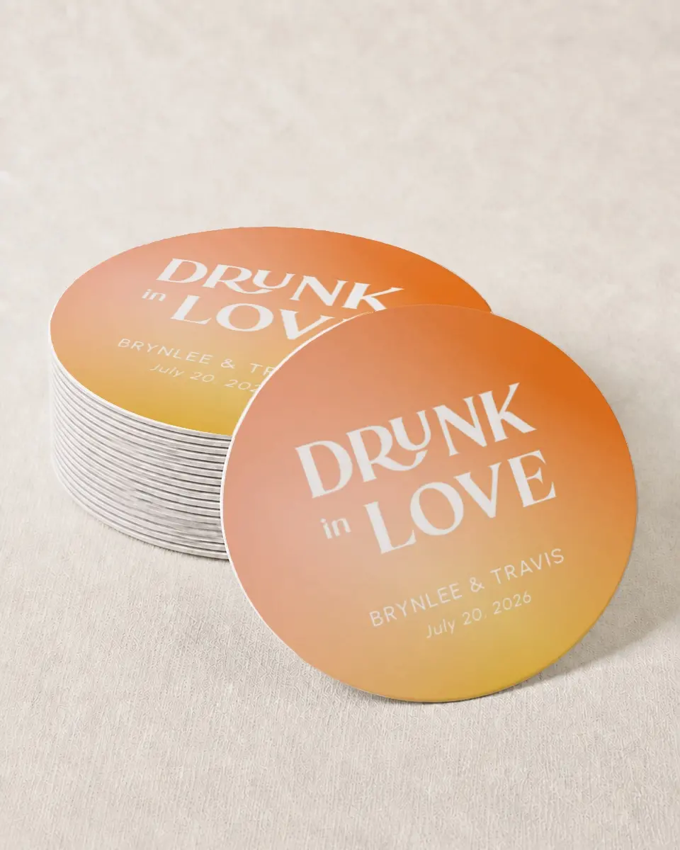 This is a 4" x 4" Wedding Coaster called Drunk In Love printed in full color with Gold foil on Kraft Chipboard paper