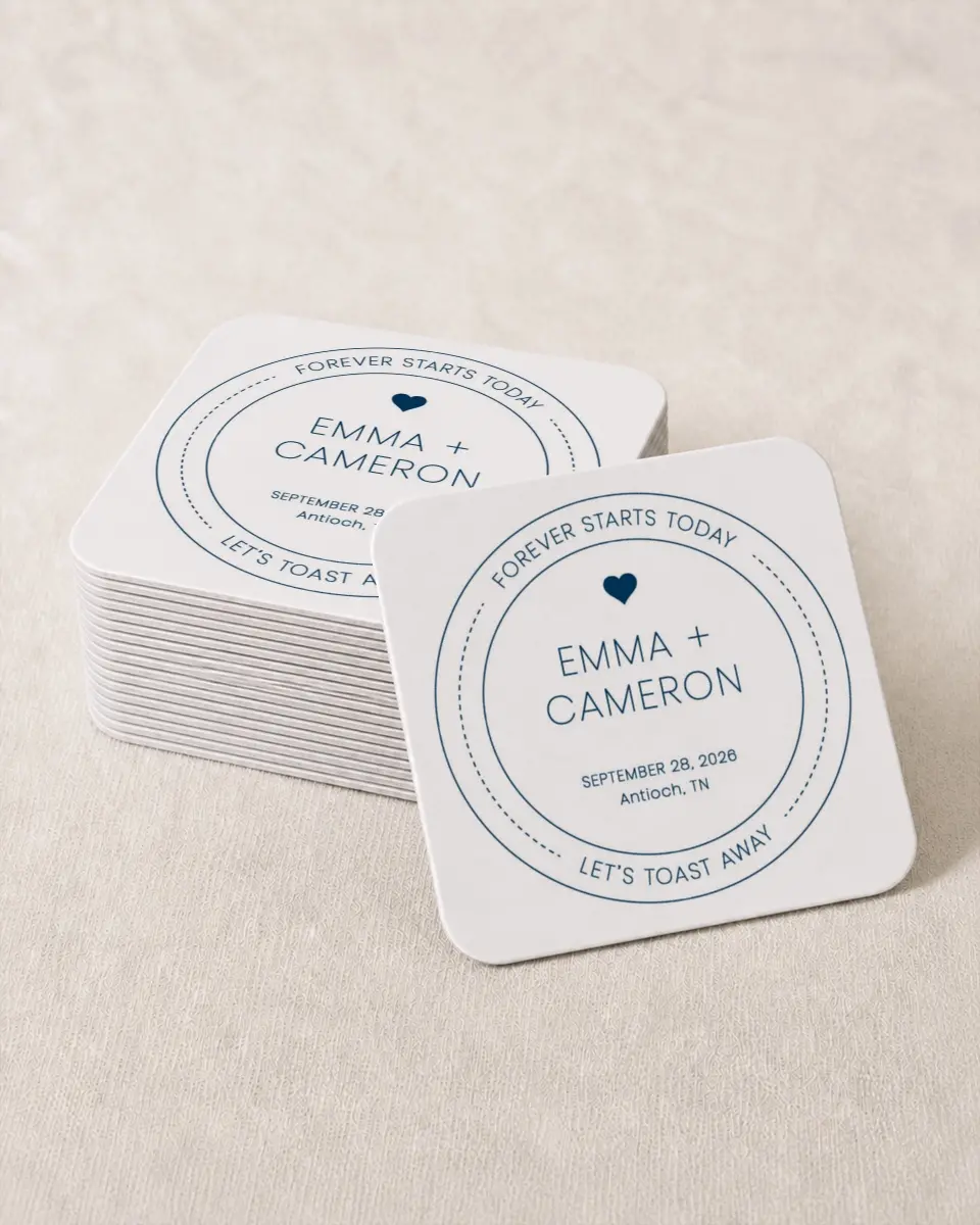 This is a 4" x 4" Wedding Coaster called Toast the Day printed in full color with Rose Gold foil on Kraft Chipboard paper