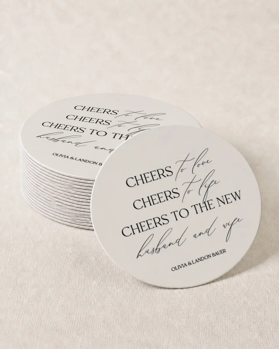 This is a 4" x 4" Wedding Coaster called Newlywed Cheers printed in full color with Gold foil on Kraft Chipboard paper