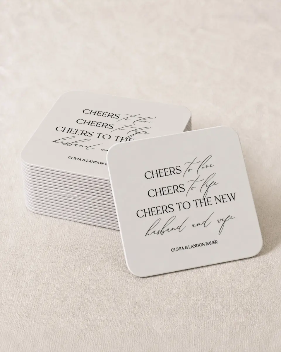 This is a 4" x 4" Wedding Coaster called Newlywed Cheers printed in full color with Gold foil on Kraft Chipboard paper