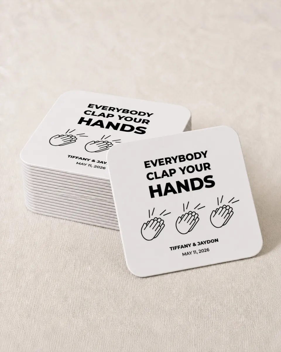 This is a 4" x 4" Wedding Coaster called Clap Your Hands printed in full color with Rose Gold foil on Kraft Chipboard paper