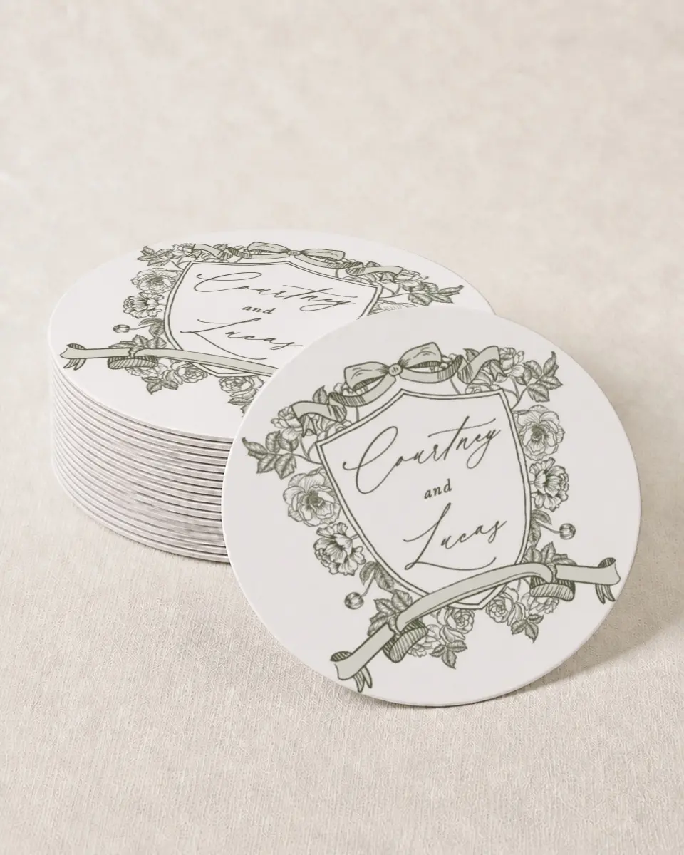 This is a 4" x 4" Wedding Coaster called Elegant Crest printed in full color with Gold foil on Kraft Chipboard paper