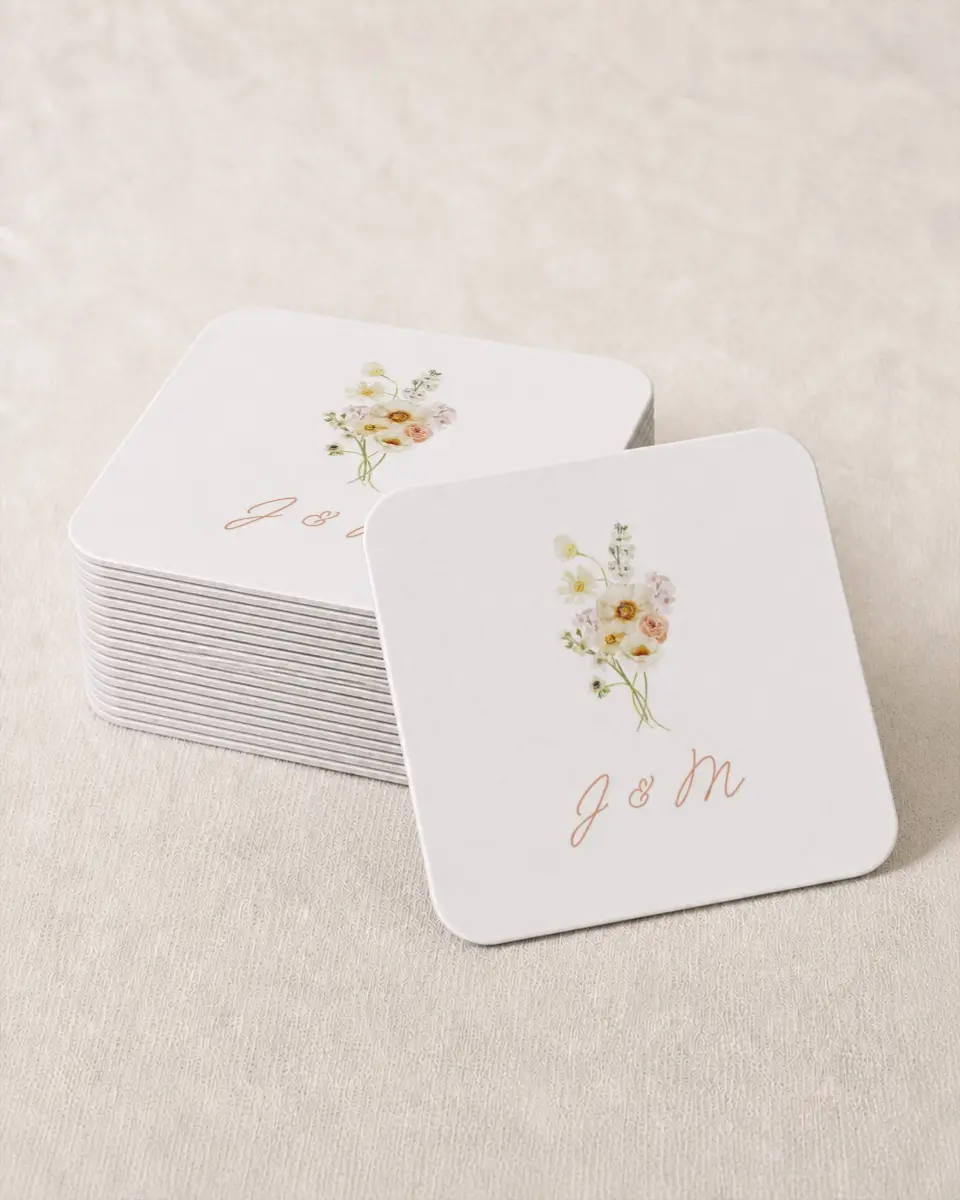 This is a 4" x 4" Wedding Coaster called Warm Wildflowers printed in full color with Gold foil on Kraft Chipboard paper