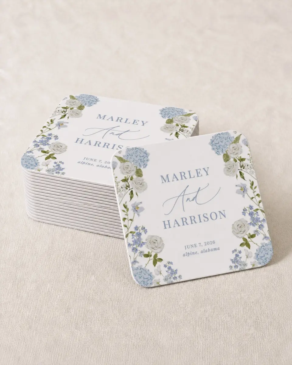 This is a 4" x 4" Wedding Coaster called Blue Blossoms printed in full color with Gold foil on Kraft Chipboard paper